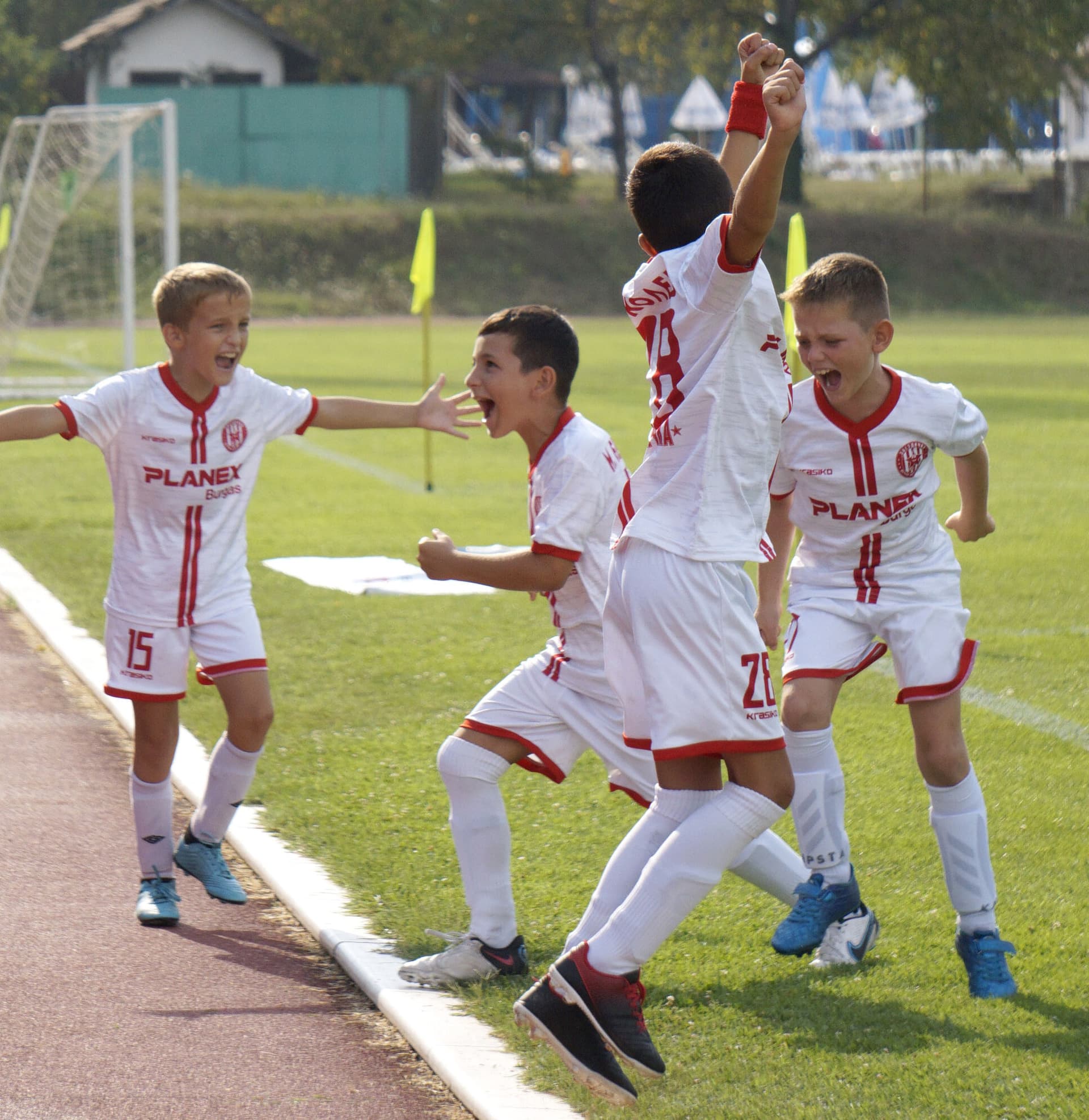 Young players celebrating a goal